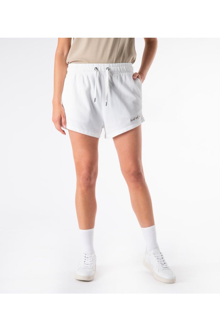 White fleece shorts for women featuring elasticated drawstring waist